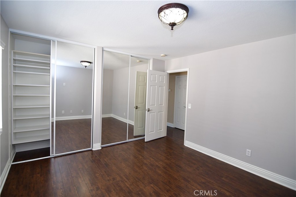 3 Ei Corzo Rancho Santa Margarita, CA 92688 - Photo 14 of 31 an empty room with wooden floor closet and windows