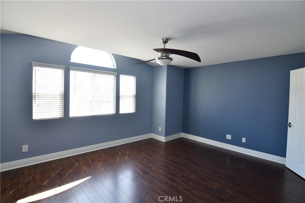 3 Ei Corzo Rancho Santa Margarita, CA 92688 - Photo 16 of 31 a view of an empty room with wooden floor and a window
