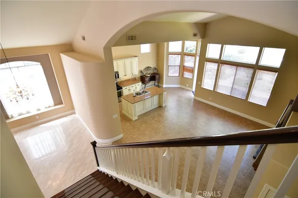 an empty room with a fireplace and window