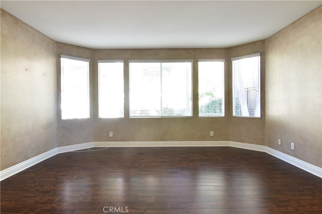 3 Ei Corzo Rancho Santa Margarita, CA 92688 - Photo 22 of 31 a view of an empty room with wooden floor and a window