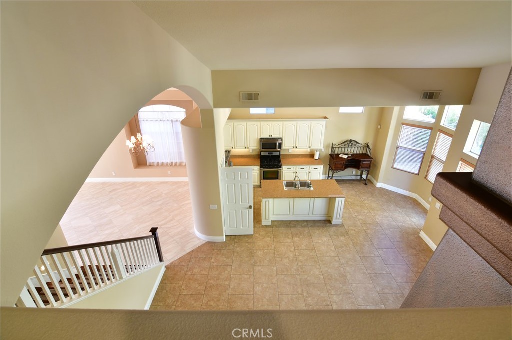3 Ei Corzo Rancho Santa Margarita, CA 92688 - Photo 25 of 31 a living room with furniture and a table
