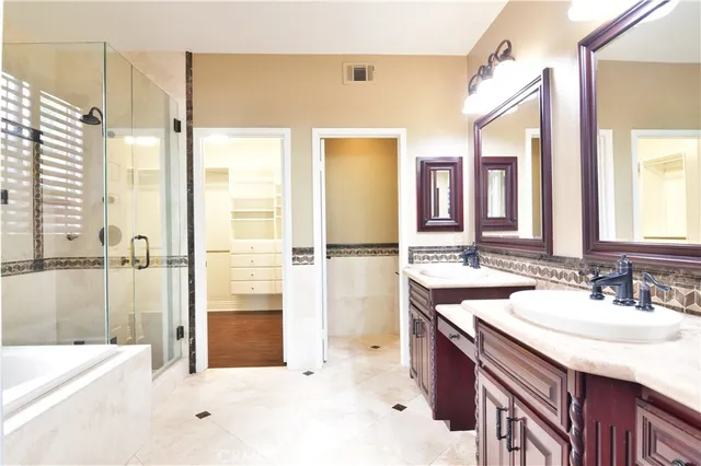 a bathroom with a bathtub and a shower