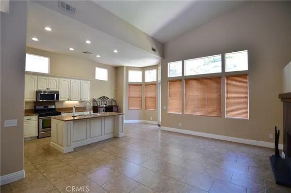 a kitchen with stainless steel appliances granite countertop a stove and a sink