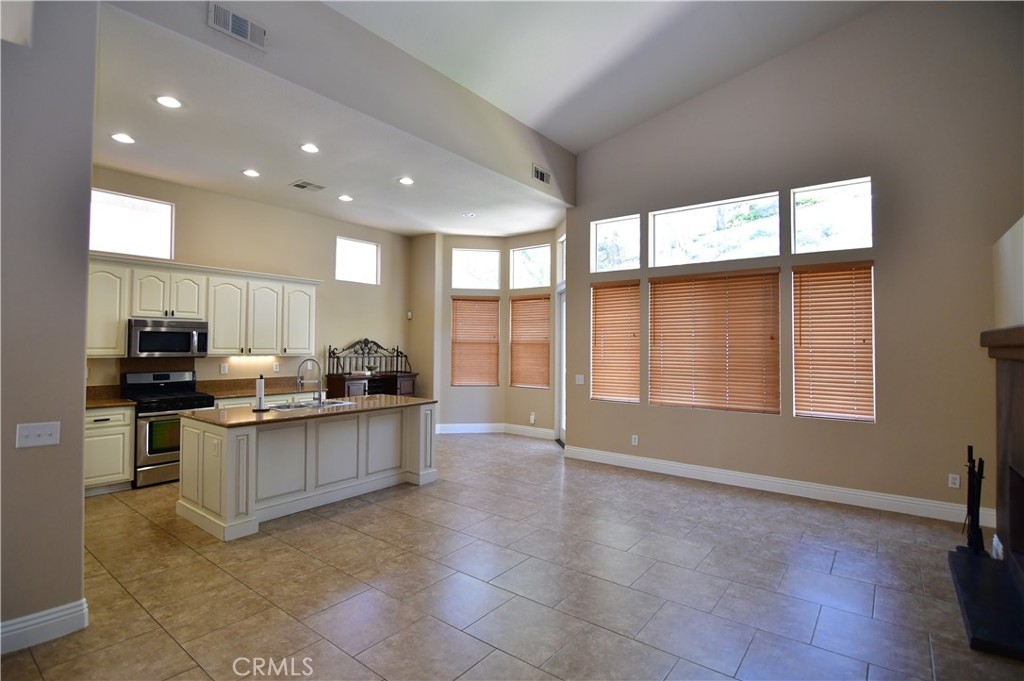 3 Ei Corzo Rancho Santa Margarita, CA 92688 - Photo 3 of 31 a kitchen with stainless steel appliances granite countertop a stove and a sink