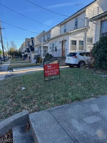 a view of a house with a back yard