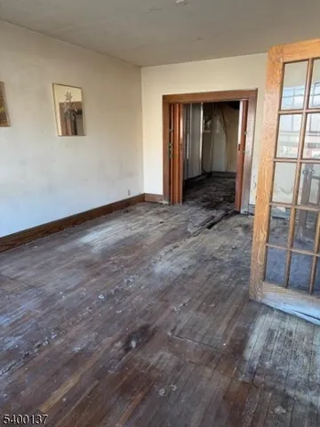 a view of an empty room with a fireplace