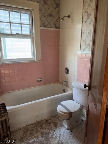 a kitchen with kitchen island a counter space and a sink