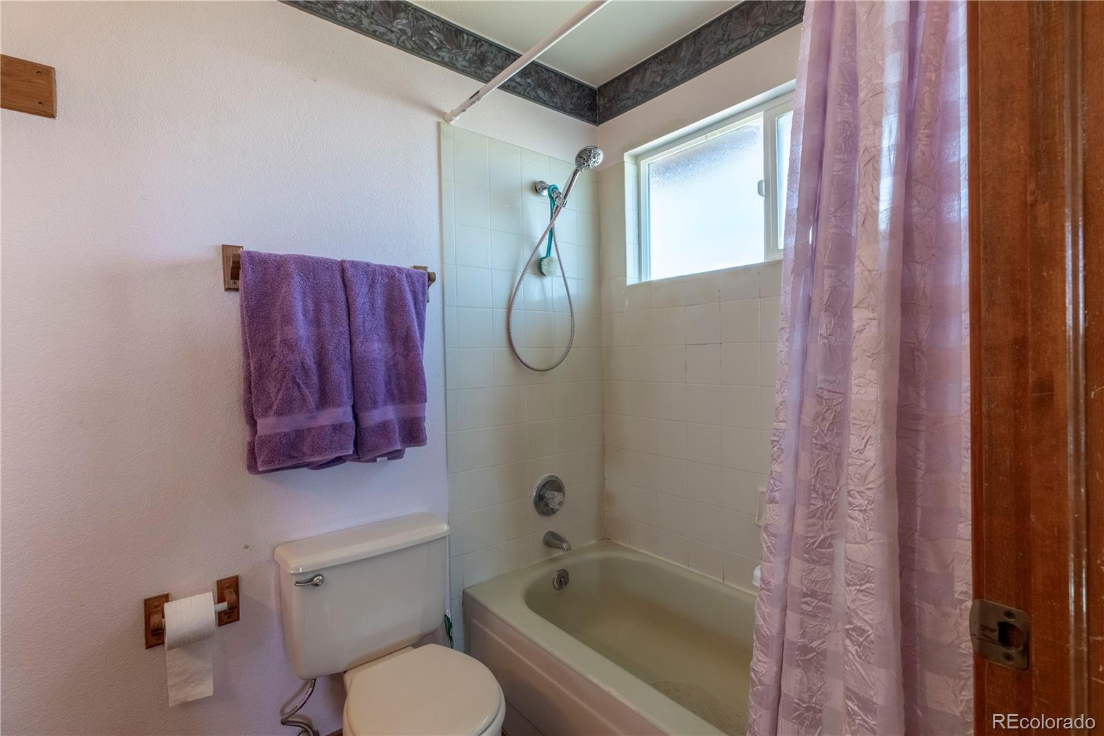 2141 Remington Road Elizabeth, CO 80107 - Photo 13 of 42 a bathroom with a tub shower sink and vanity