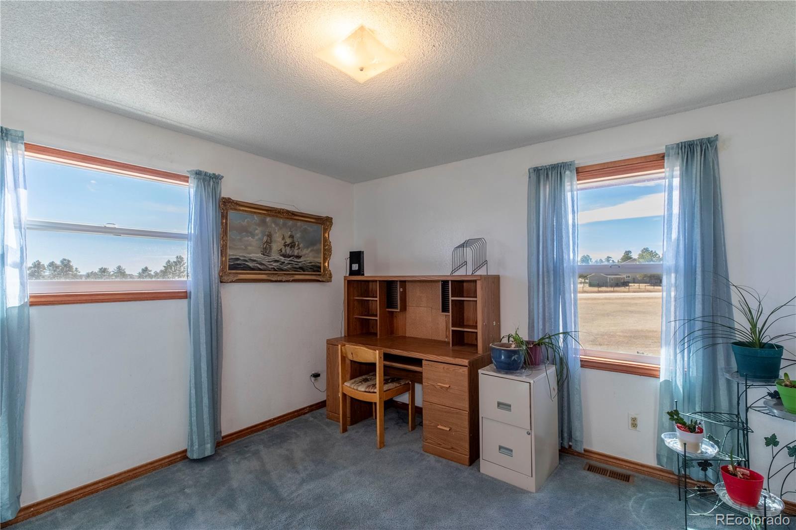 2141 Remington Road Elizabeth, CO 80107 - Photo 16 of 42 a room with furniture and window