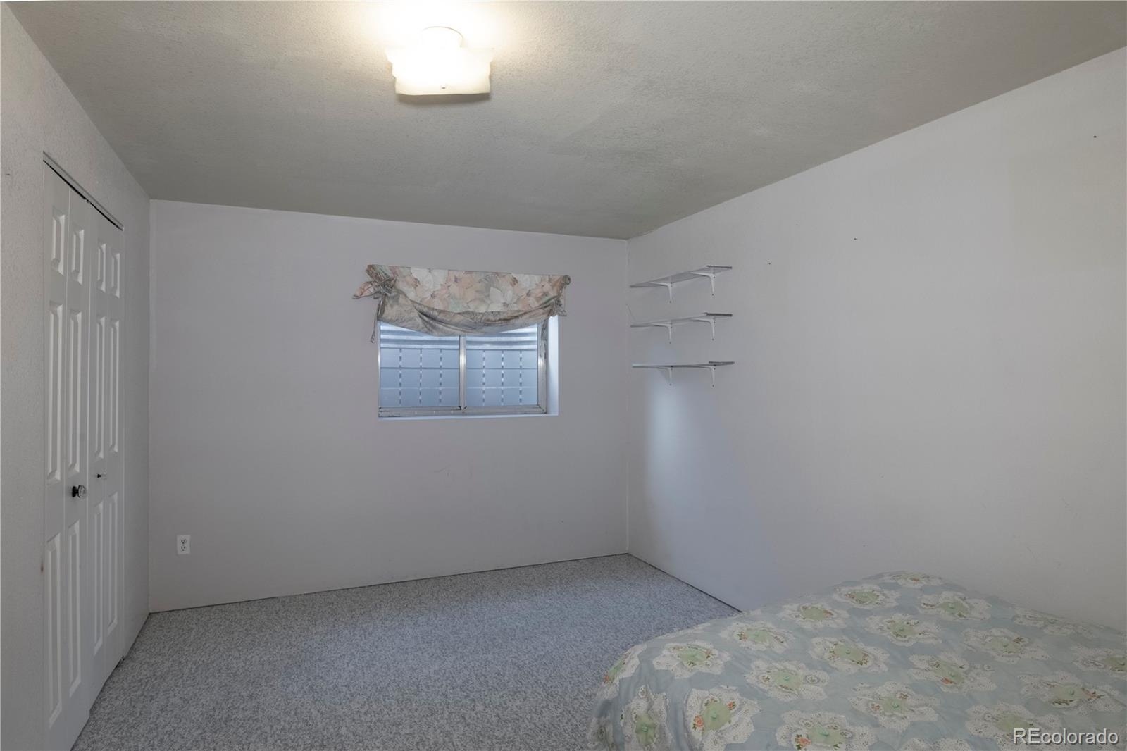 2141 Remington Road Elizabeth, CO 80107 - Photo 21 of 42 a room with a bed and a window