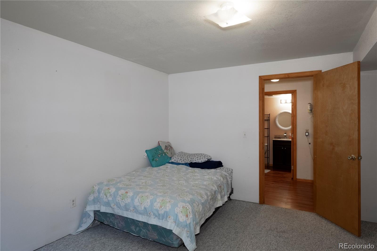 2141 Remington Road Elizabeth, CO 80107 - Photo 22 of 42 a bedroom with a bed and closet