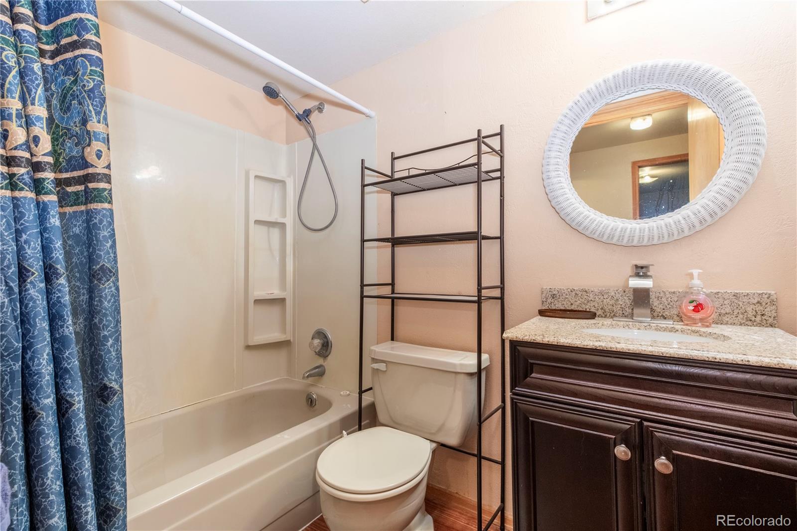2141 Remington Road Elizabeth, CO 80107 - Photo 23 of 42 a bathroom with a sink a toilet and a mirror