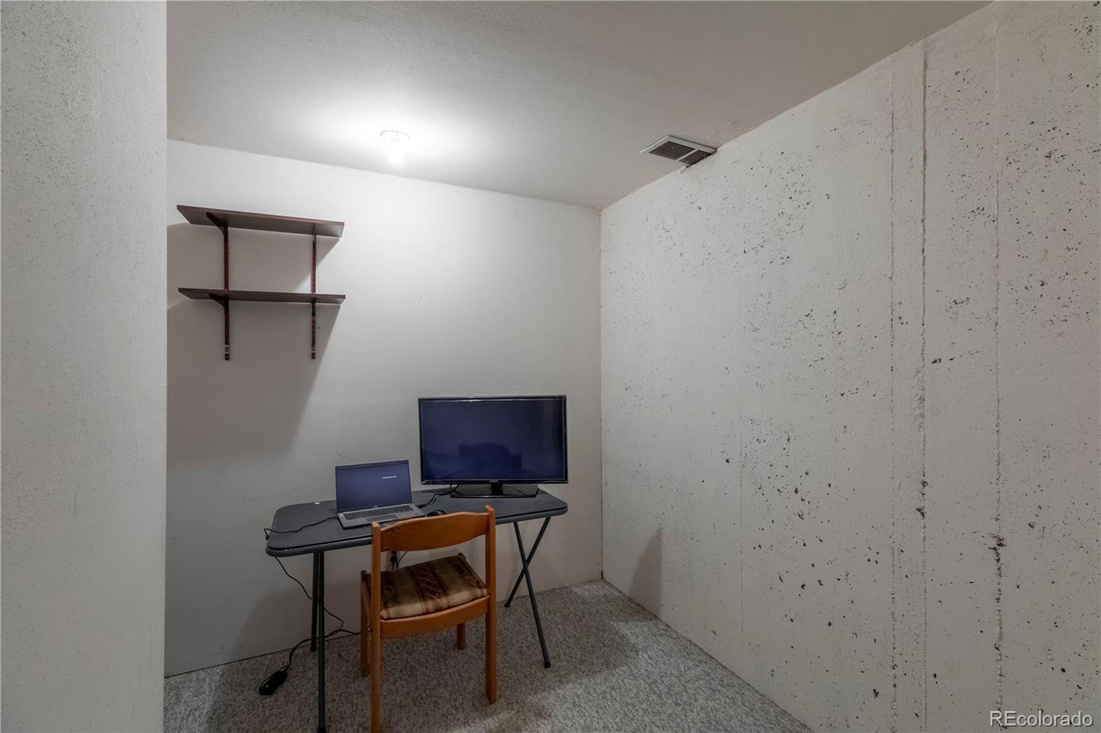 2141 Remington Road Elizabeth, CO 80107 - Photo 24 of 42 a room with a table and chairs