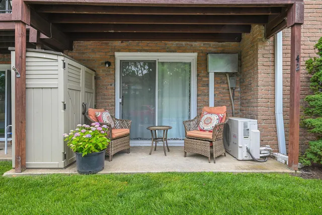 a house view with a seating space and garden