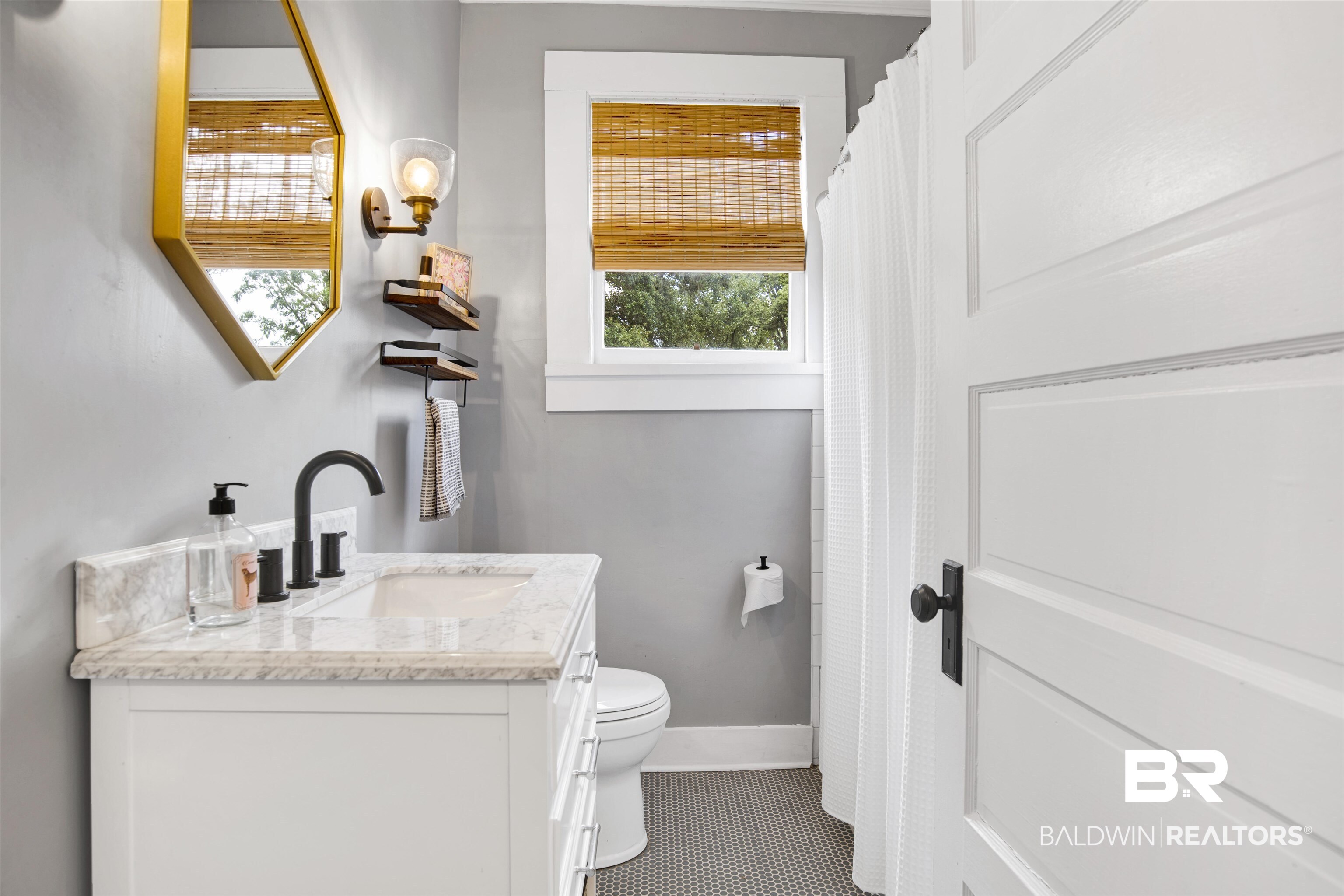 123 Macy Place Mobile, AL 36604 - Photo 19 of 35 Bathroom featuring vanity, curtained shower, and tile patterned floors