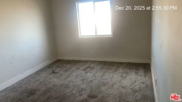 a view of a room that has a window in it