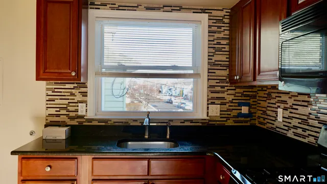 a kitchen with a sink and a window
