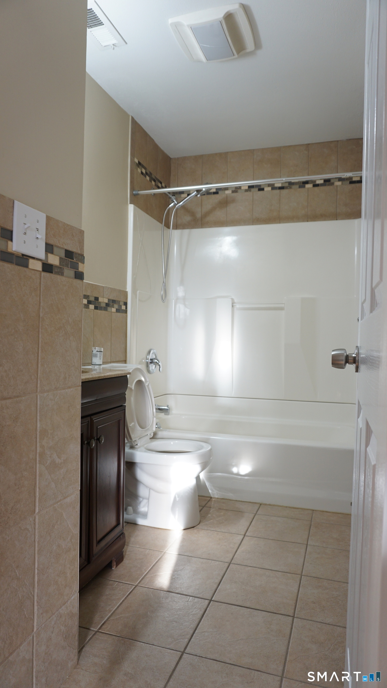 28 Sampson Street, Unit 4 Bridgeport, CT 06606 - Photo 5 of 30 a bathroom with a sink a toilet and shower