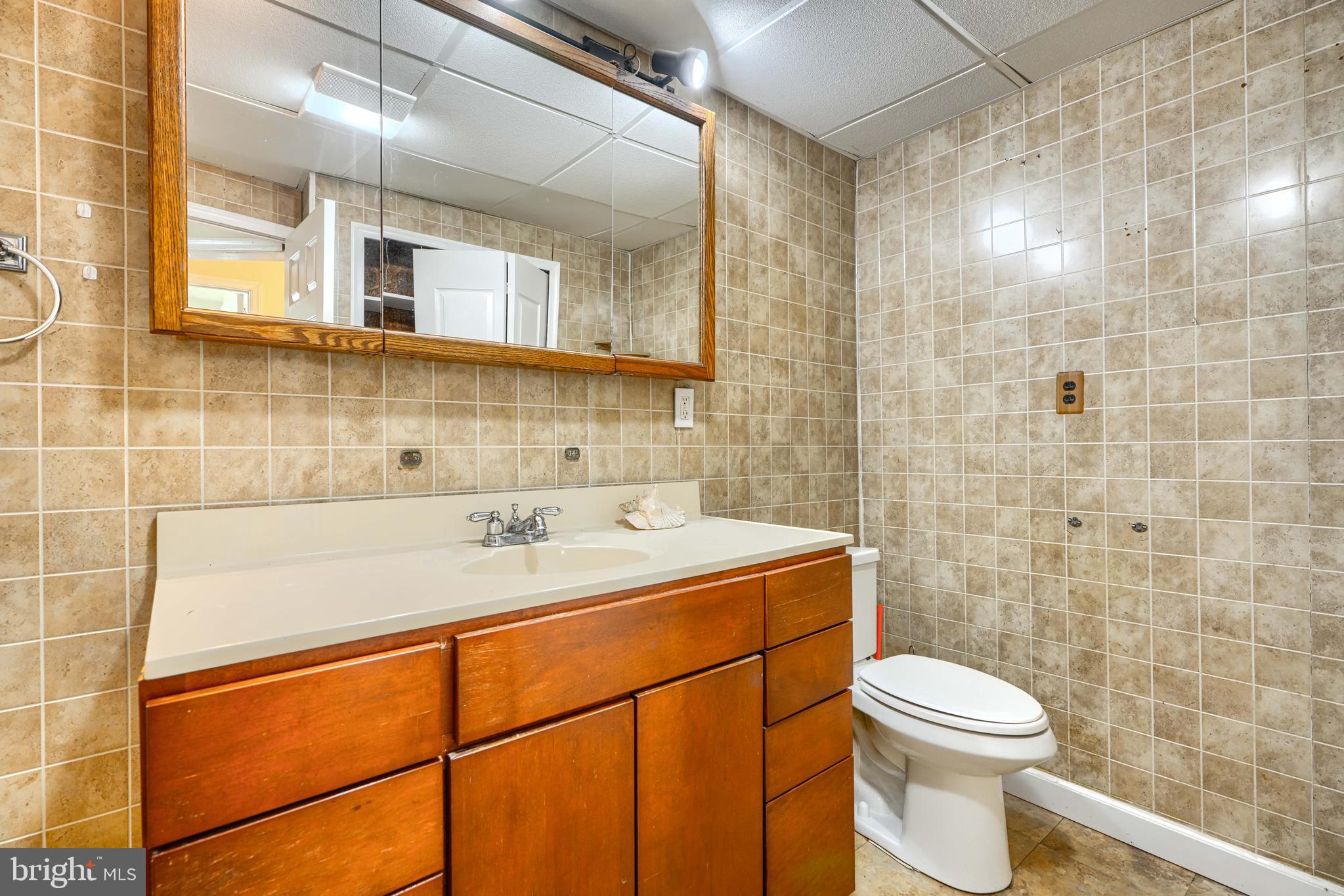 2215 Lodge Farm Road Baltimore, MD 21219 - Photo 14 of 38 Full Bath with 2 linen closets (main level)
