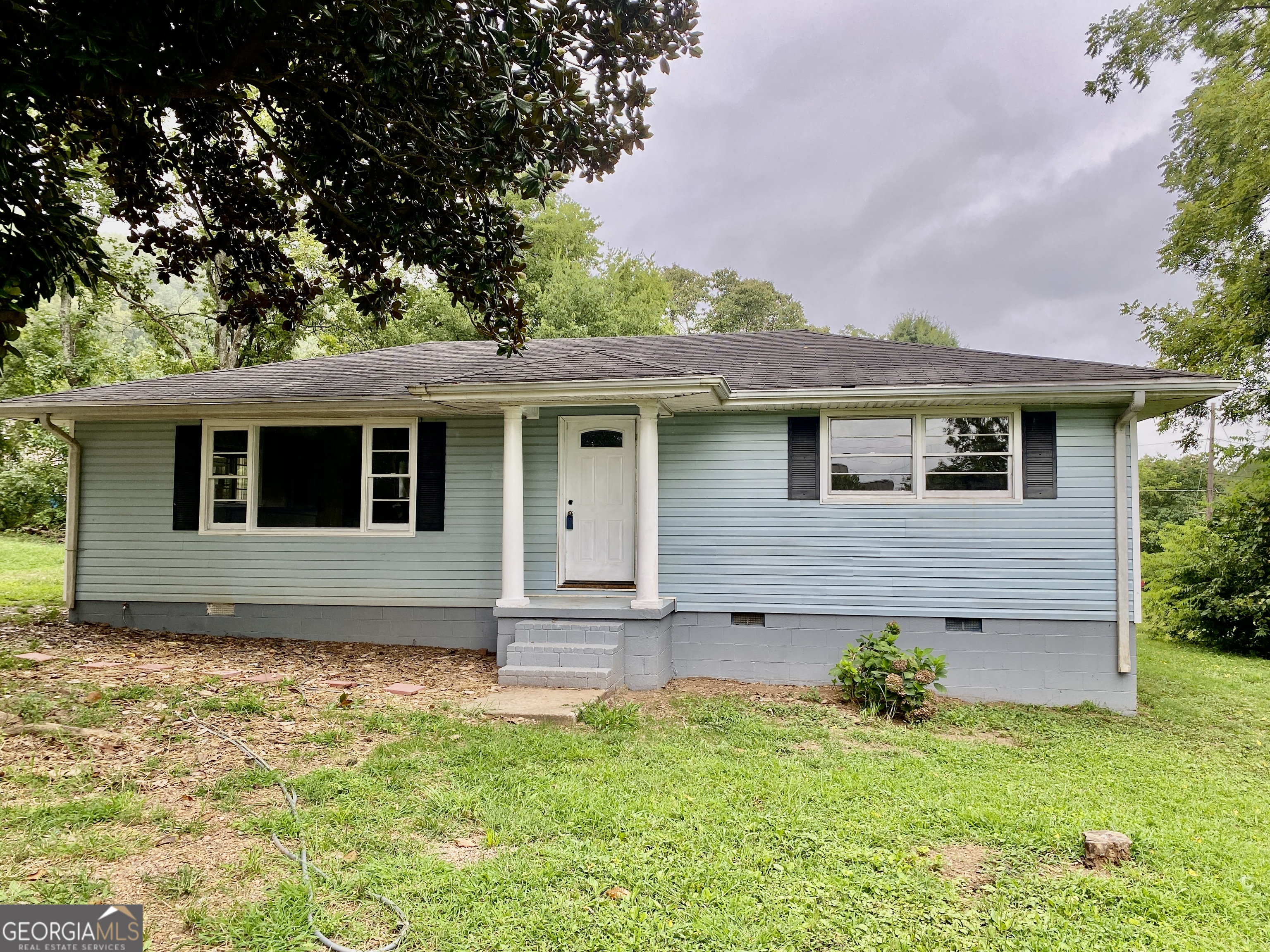 a house view with a garden space