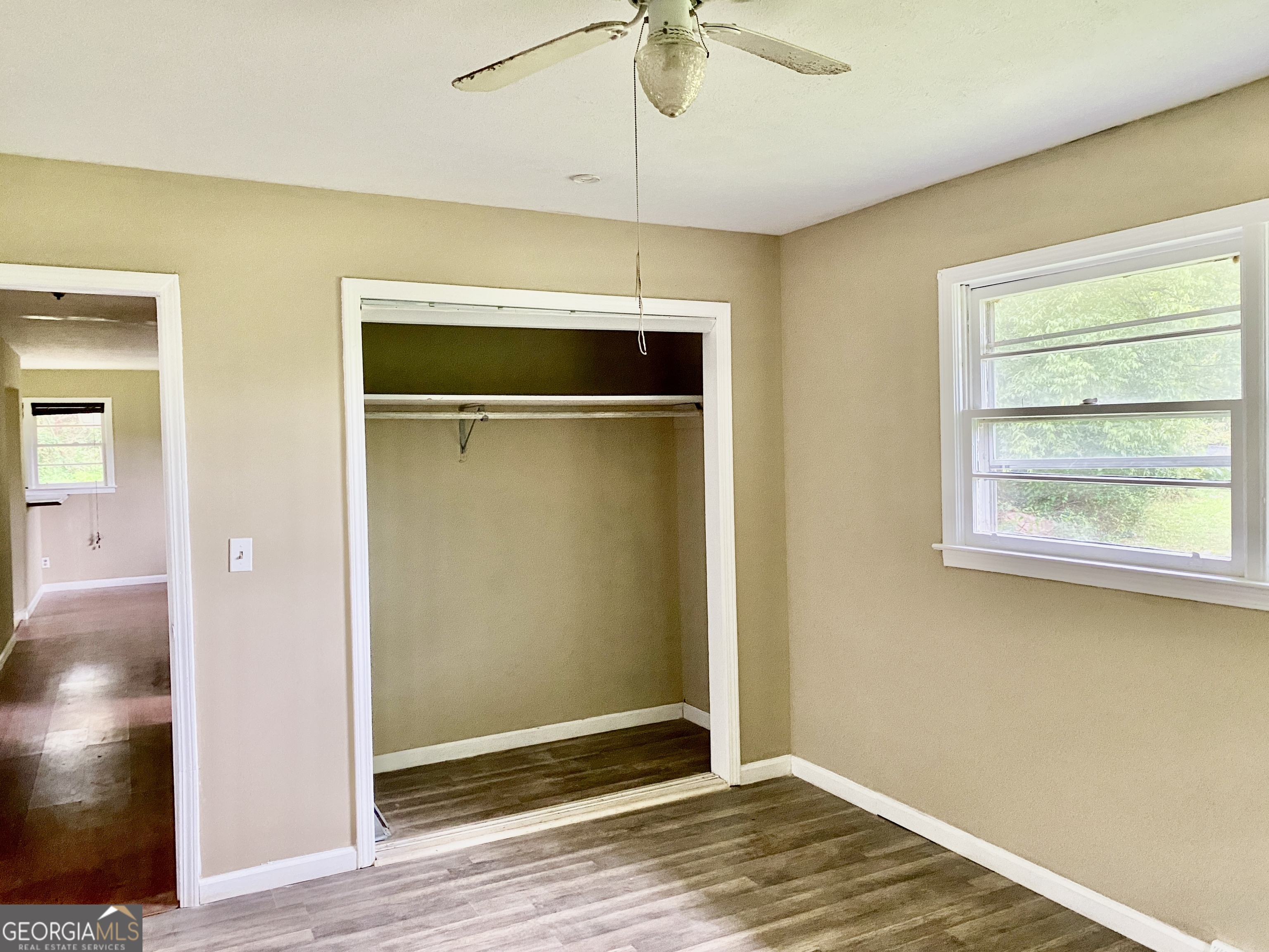 514 Booze Mountain Road Southeast Lindale, GA 30161 - Photo 12 of 13 a view of an empty room with window and wooden floor