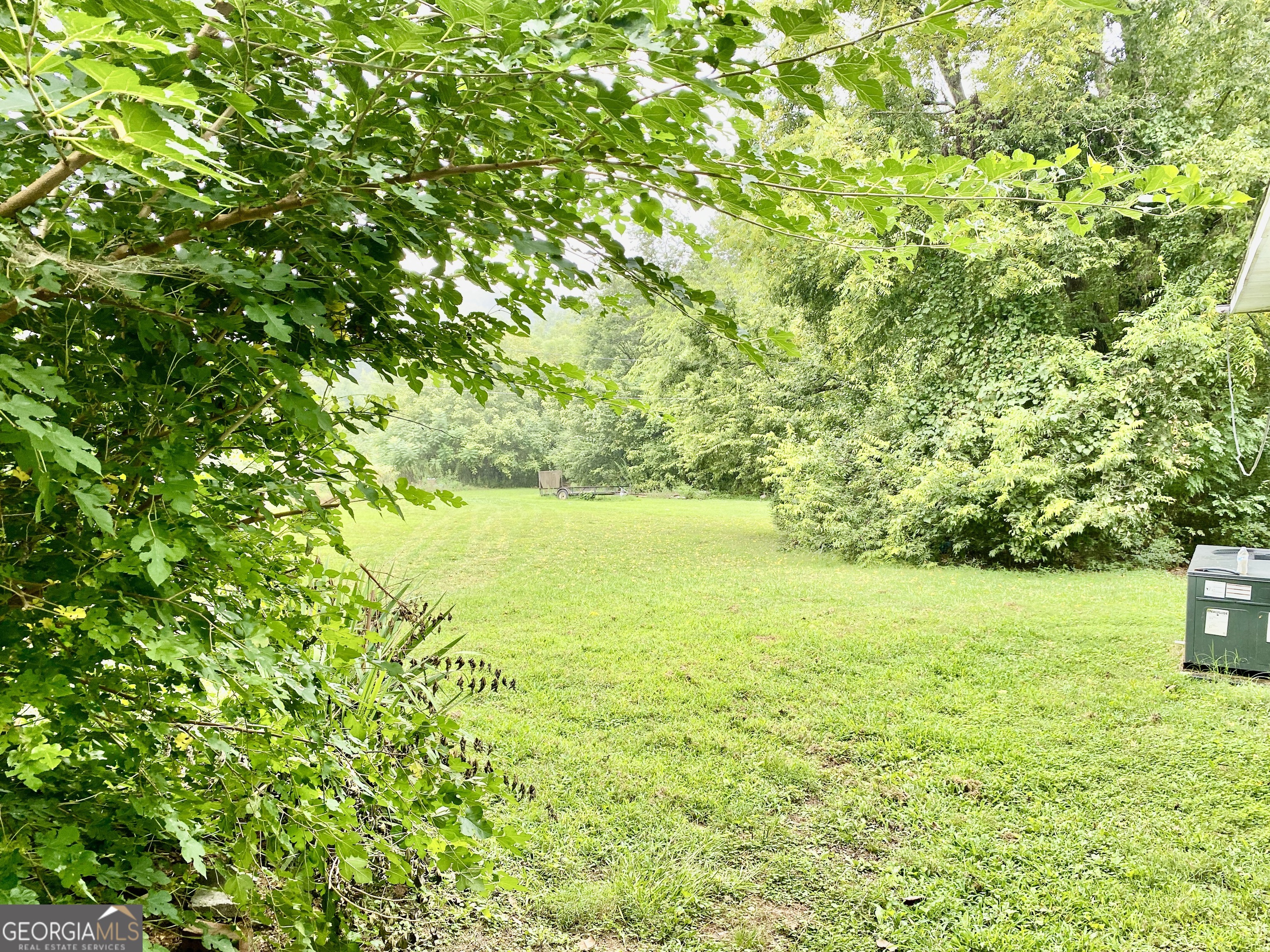 514 Booze Mountain Road Southeast Lindale, GA 30161 - Photo 13 of 13 a view of yard with swimming pool and trees