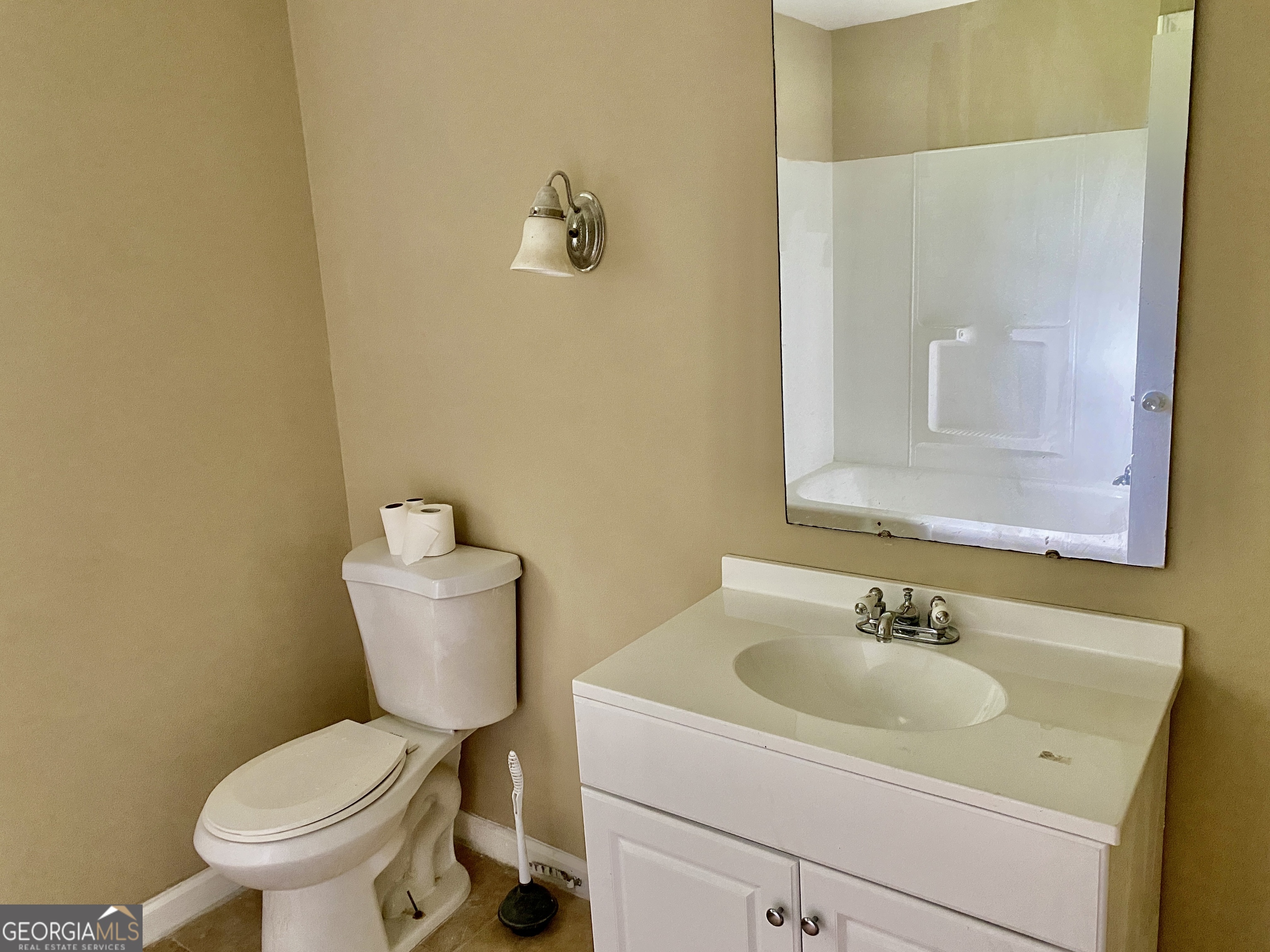 514 Booze Mountain Road Southeast Lindale, GA 30161 - Photo 8 of 13 a bathroom with a sink toilet and a mirror