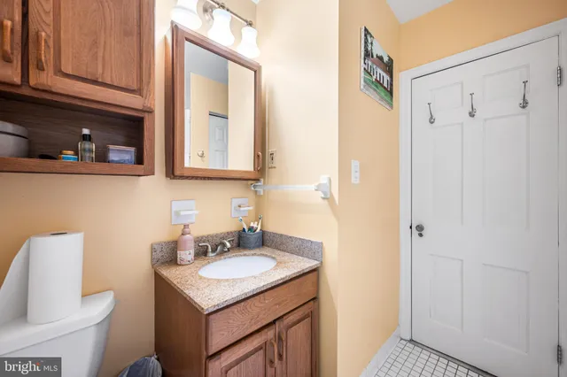 a bathroom with a sink toilet and vanity