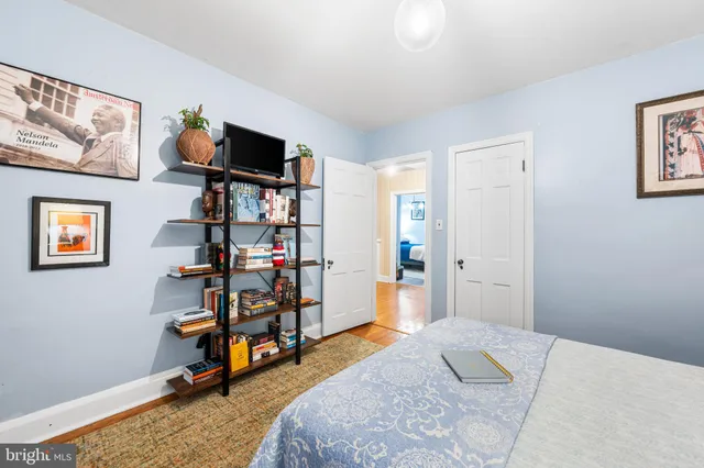 a bedroom with bed and a window