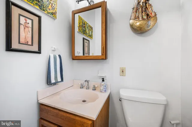 a bathroom with a toilet and a sink