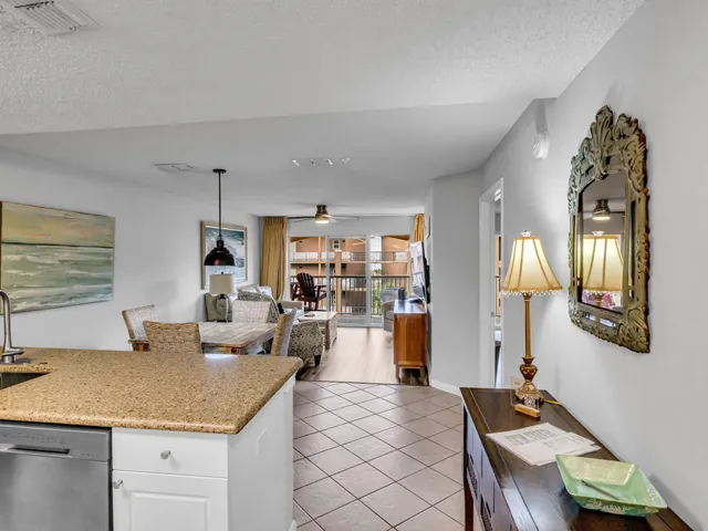a living room with furniture and a lamp