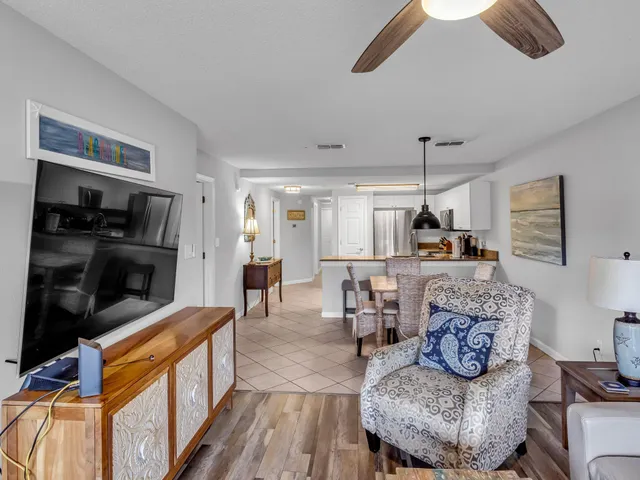 a kitchen with stainless steel appliances granite countertop a refrigerator stove and microwave