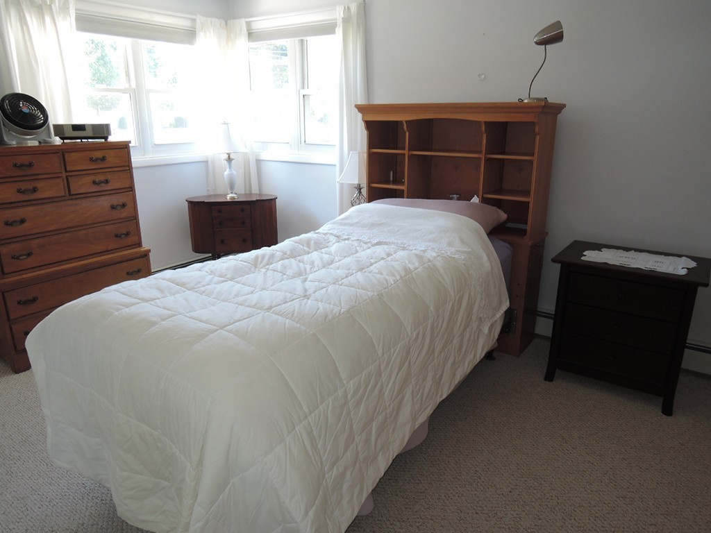 5 Temi Road Framingham, MA 01701 - Photo 13 of 27 a bed sitting in a bedroom next to a window