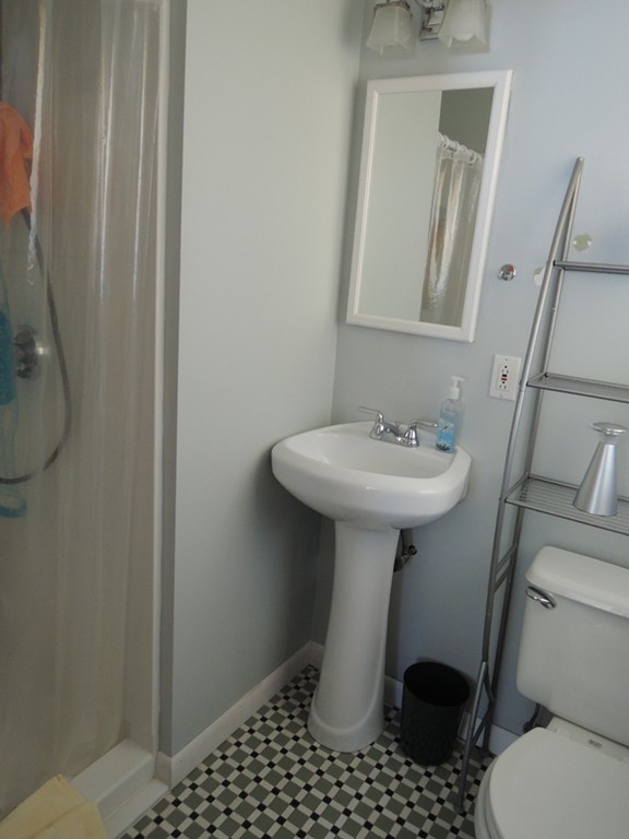 5 Temi Road Framingham, MA 01701 - Photo 16 of 27 a bathroom with a sink toilet and a mirror