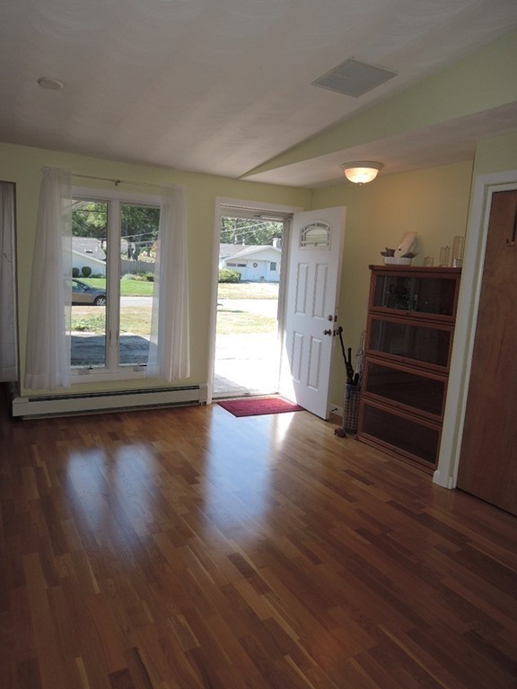5 Temi Road Framingham, MA 01701 - Photo 4 of 27 an empty room with wooden floor and windows