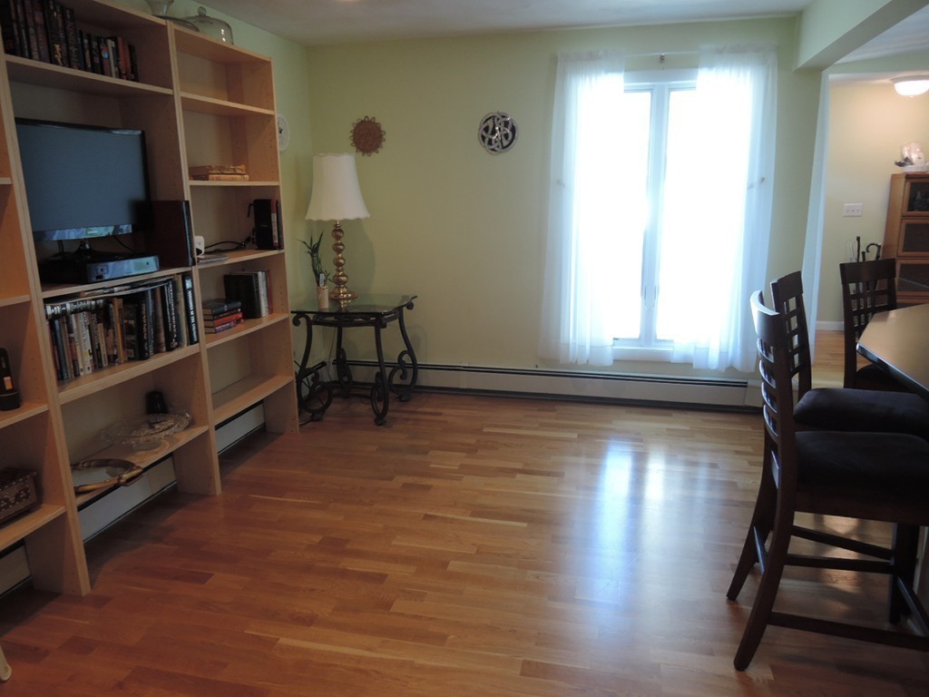 5 Temi Road Framingham, MA 01701 - Photo 8 of 27 a view of a livingroom with furniture and closet