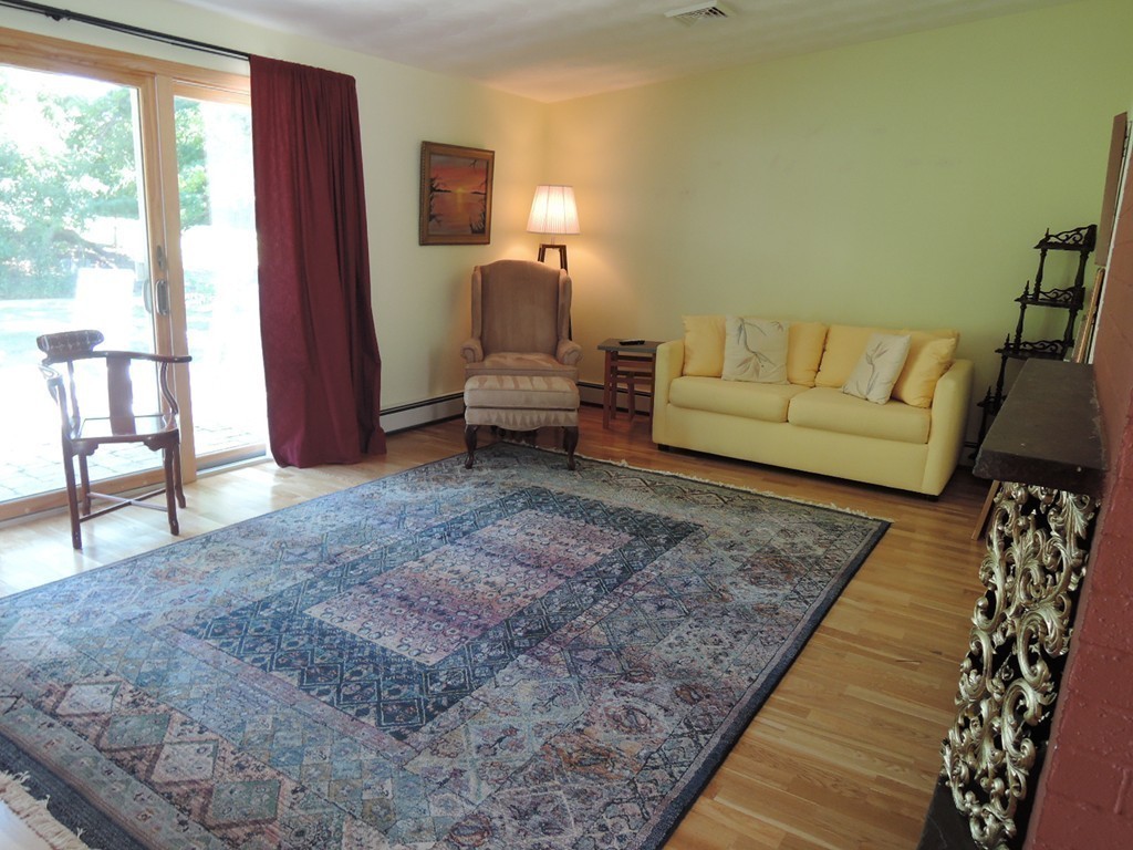5 Temi Road Framingham, MA 01701 - Photo 9 of 27 a living room with furniture and a rug