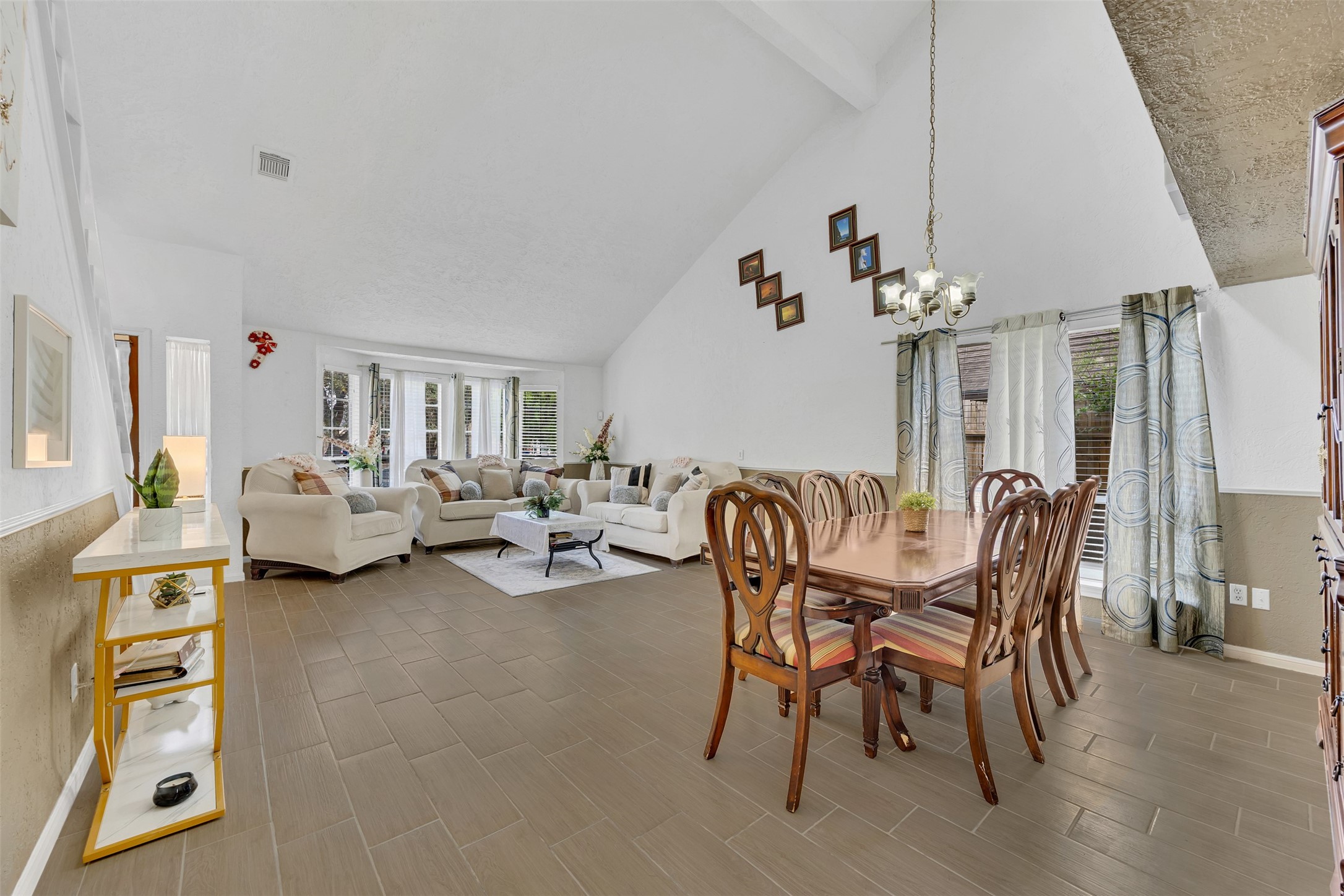 15619 Beechnut Street Houston, TX 77083 - Photo 7 of 29 The open layout connects living and dining areas seamlessly — offering an inviting flow for everyday living.