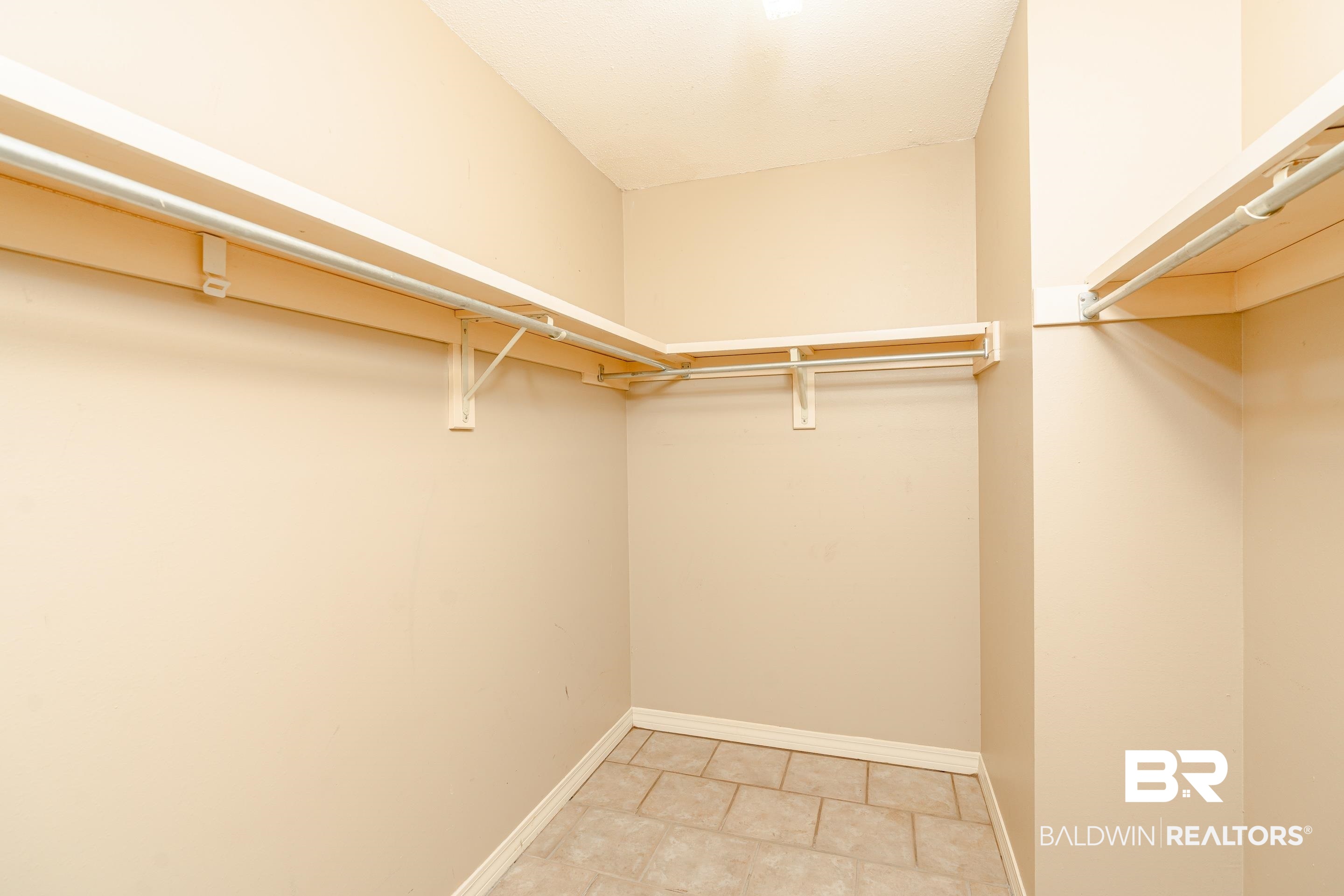 23 Old Mill Court Mobile, AL 36608 - Photo 23 of 37 Walk in closet featuring light tile patterned flooring