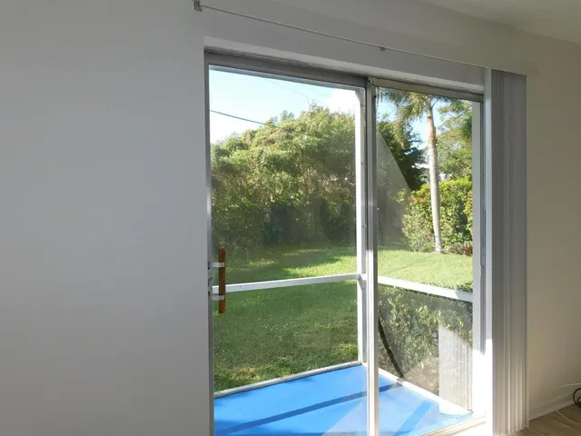 a view of window and an empty room