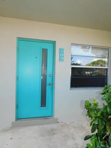 a view of a livingroom with an empty space and a fireplace