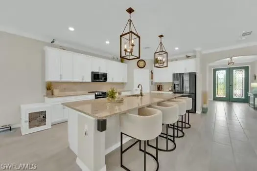 a bedroom with a bed and a tv