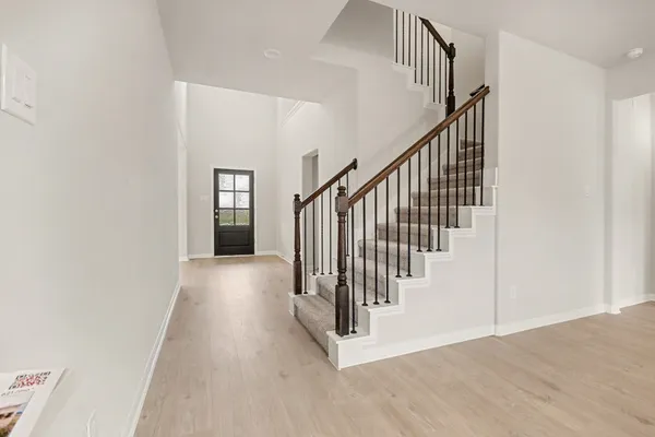a view of a hallway with staircase
