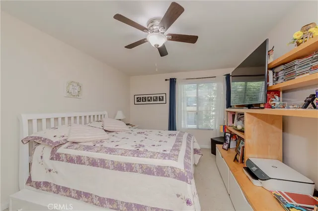 a bed room with a bed and a dresser