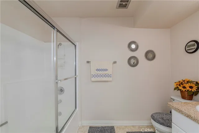 a bathroom with a shower and a sink