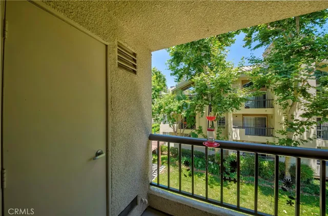 a view of a balcony with an outdoor space