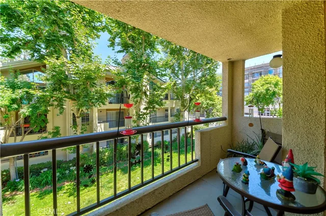 a view of a balcony with furniture