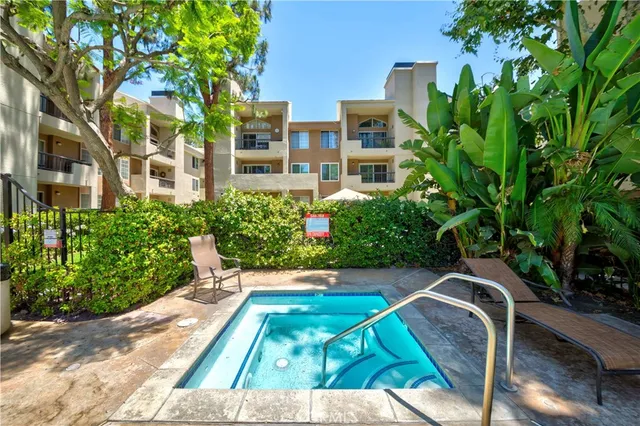 a view of a swimming pool with a patio