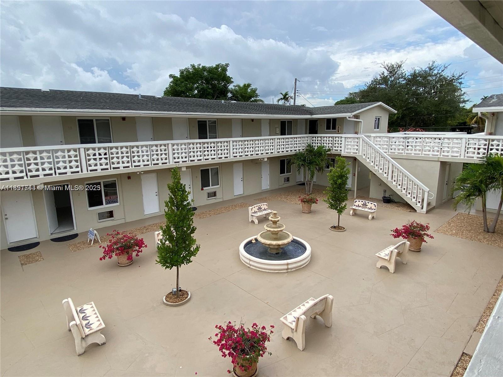 an aerial view of a house with outdoor space