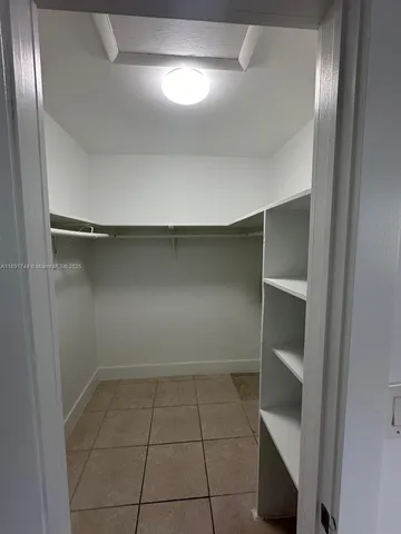 a view of an empty walk in closet